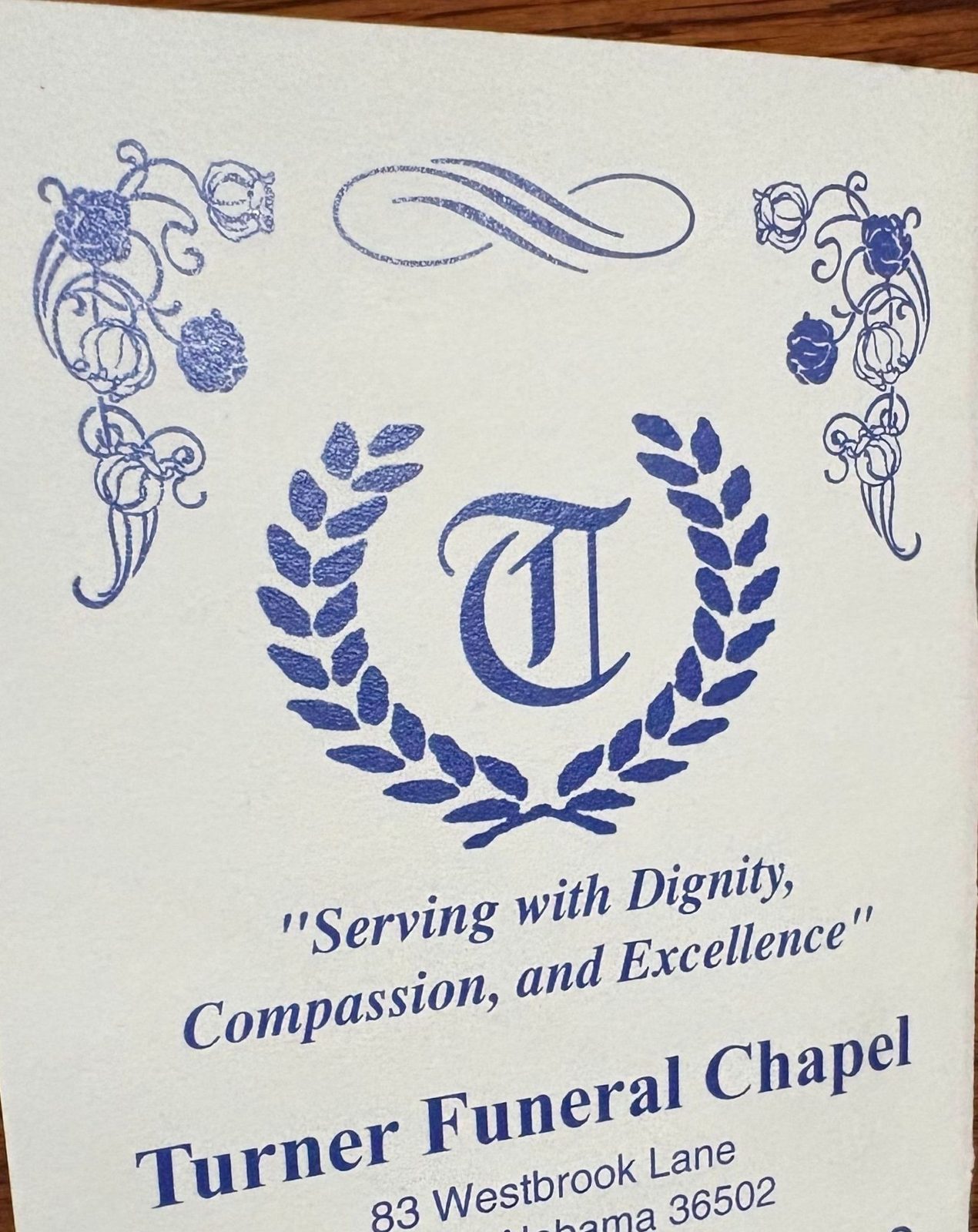 The Turner Funeral Chapel memorial card, printed with the chapel’s emblem, motto, and name.