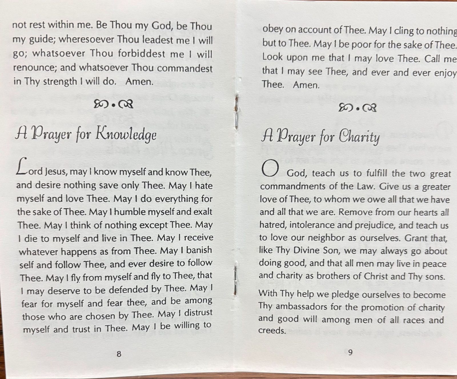 Pages 8 and 9 of Everybody’s Prayer Book, open to A Prayer for Knowledge and A Prayer for Charity.