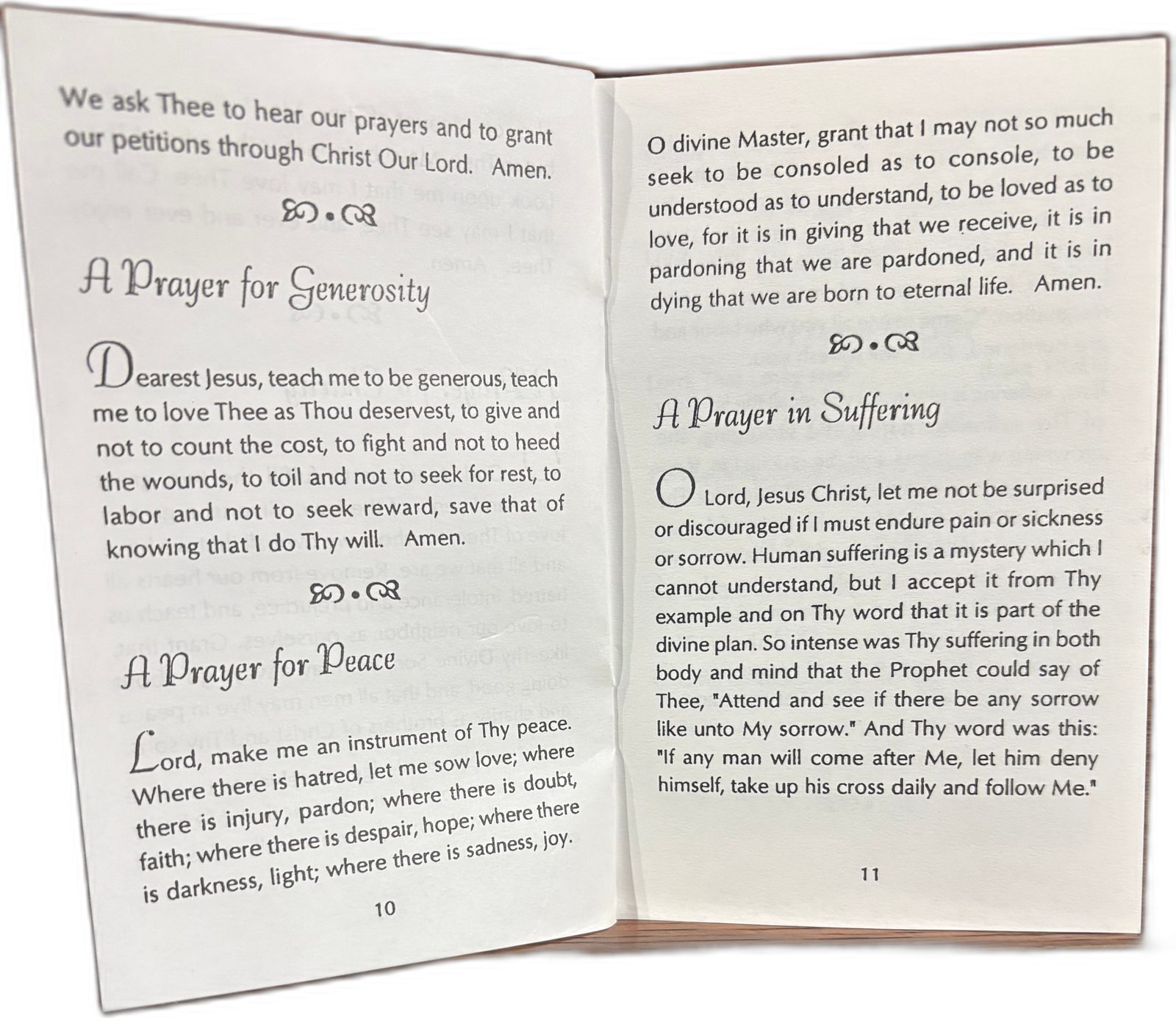 Pages 10 and 11 of Everybody’s Prayer Book, open to A Prayer for Generosity, A Prayer for Peace, and A Prayer in Suffering.